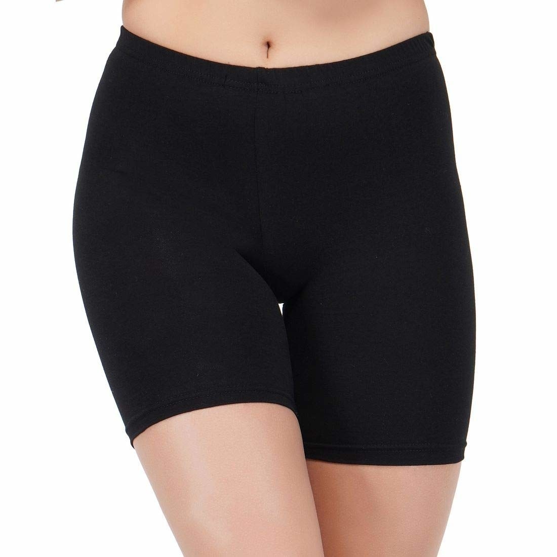 Lower body of a woman wearing black cycling shorts