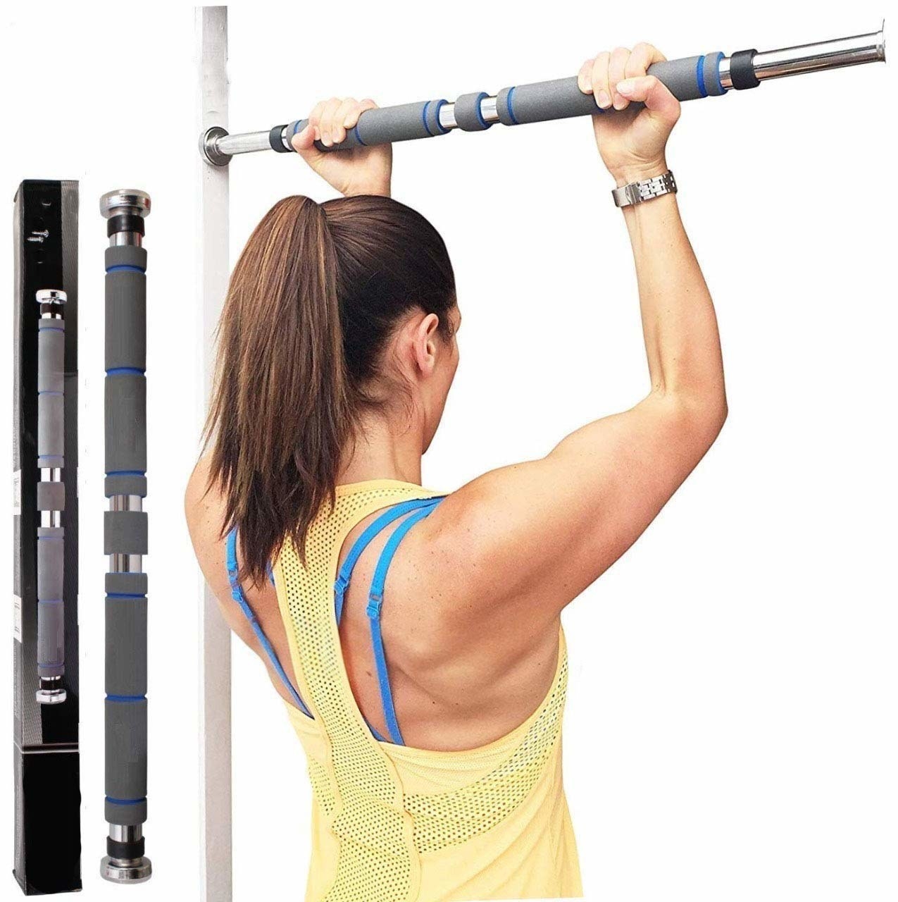 A woman using the pull up bar for pull ups.