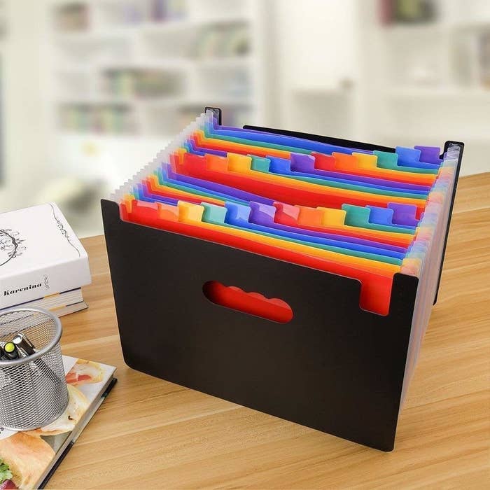 An expandable folder with multicoloured slots for easy sorting.