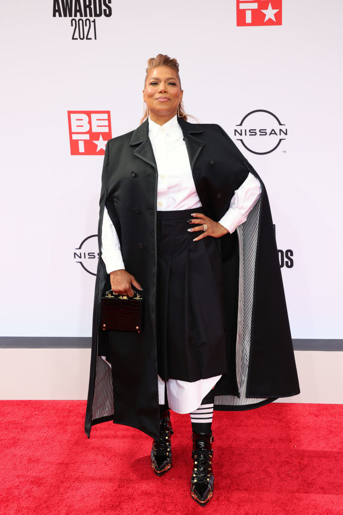 Queen Latifah attends the BET Awards 2021 in a shirt dress, cape, and matching boots