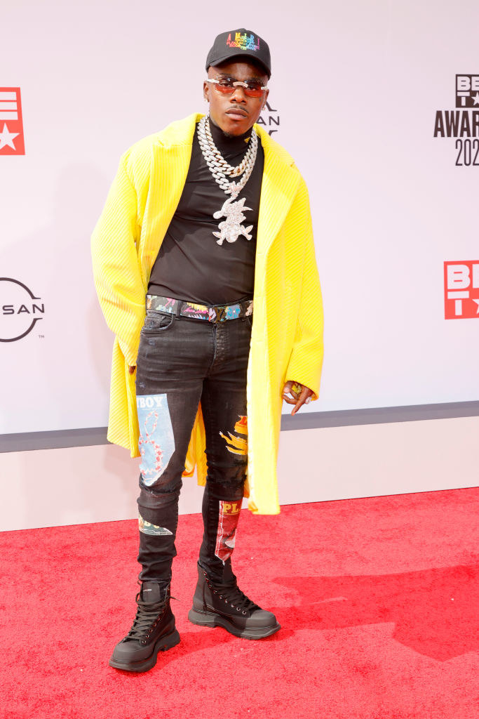 DaBaby attends the BET Awards 2021 in a long coat, jeans, and combat boots