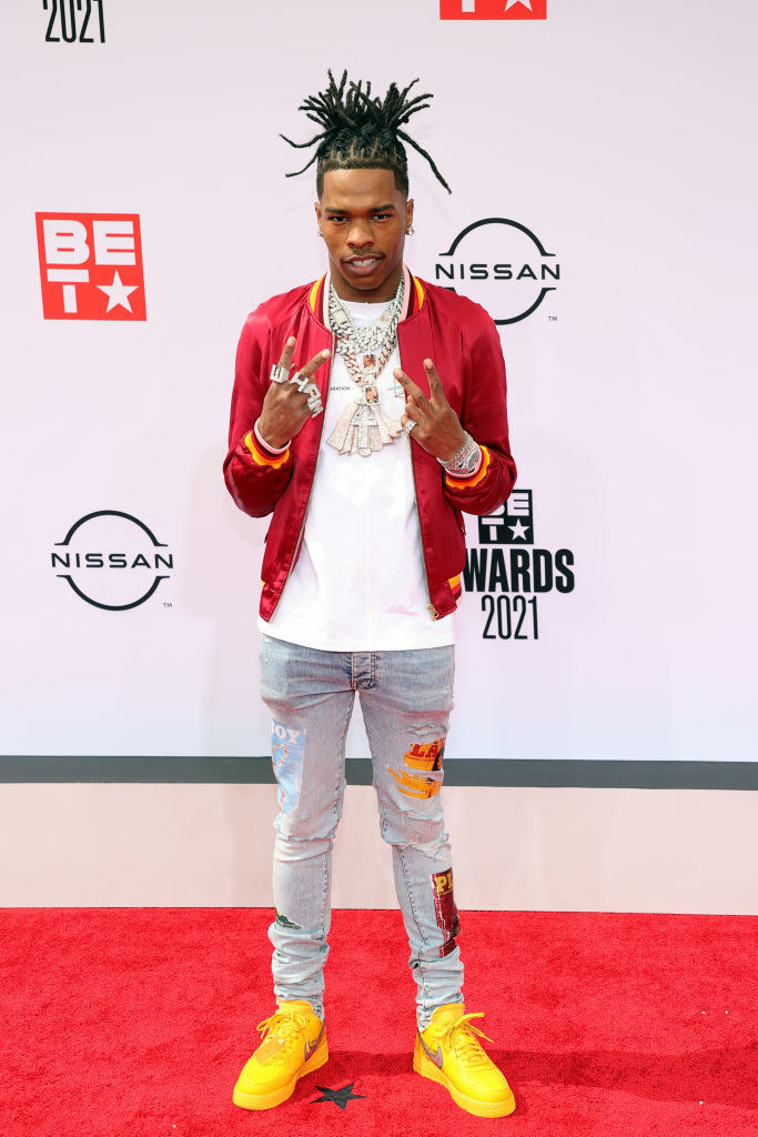 Lil Baby attends the BET Awards 2021 in a tee, jeans, and satin jacket