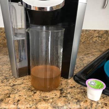 Reviewer's picture of their Keurig machine being cleaned by the cleaning cup 