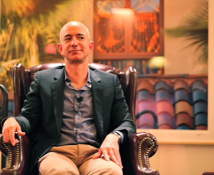 Amazon CEO Jeff Bezos seated at an event