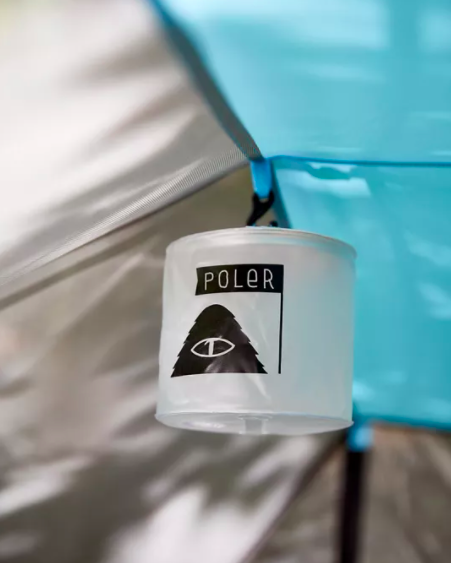 A solar-powered lamp hanging in a tent