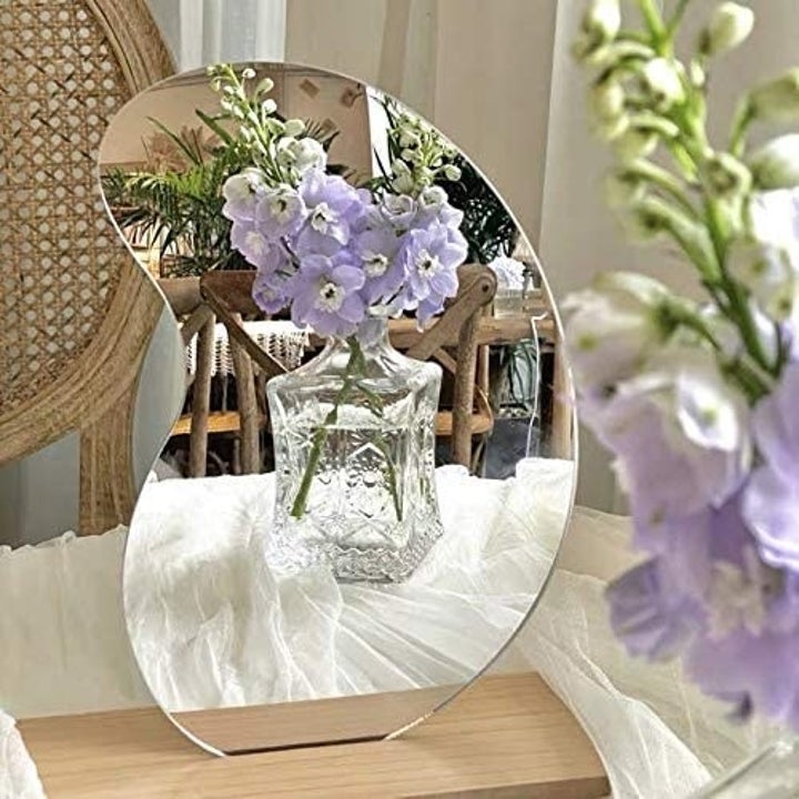mirror upright on wood placemat 
