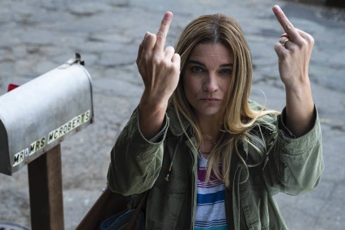 Allison McRoberts holding two middle fingers up in a scene from the show