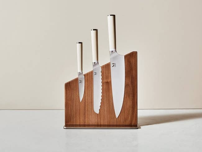 the trio of knives in a wooden block
