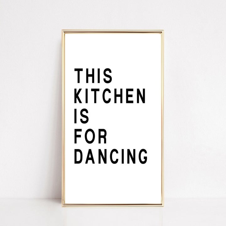 white sign that says "this kitchen is for dancing" in black block print 