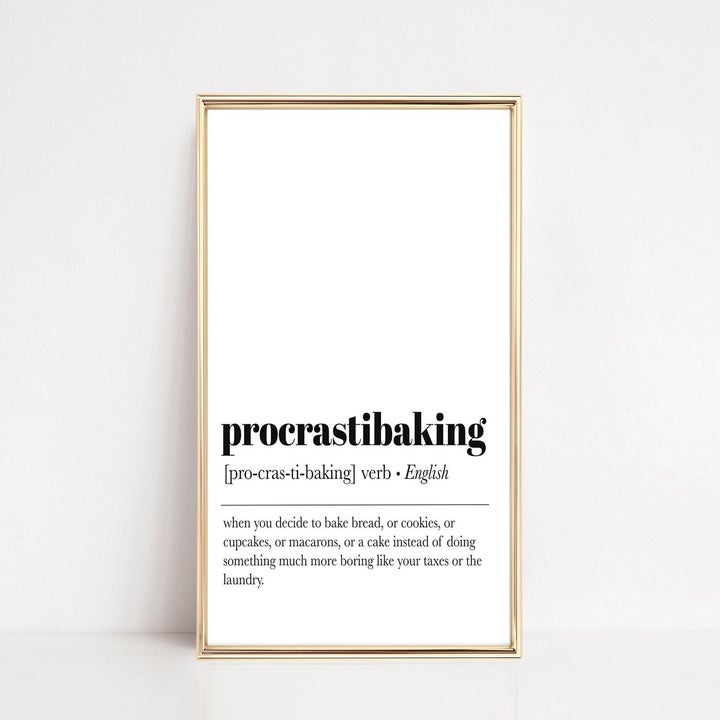 A minimalist sign that says "procrastibaking" with a definition under it