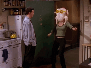 Monica shimmying with a turkey on her head in Friends