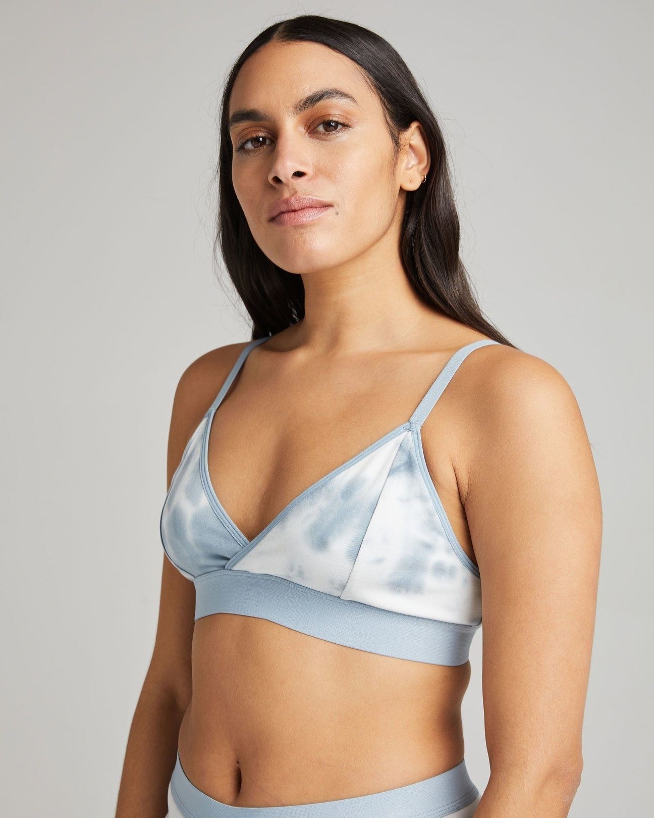 model wearing the light blue and white bralette