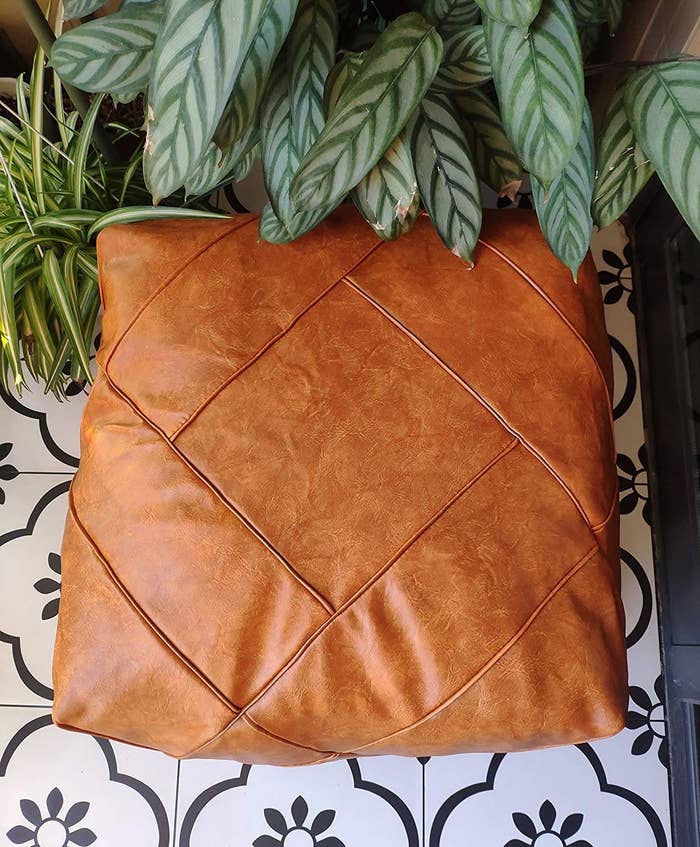 Square faux leather pouf