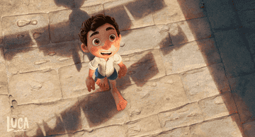 a gif of luca walking on cobble stone streets looking amazed