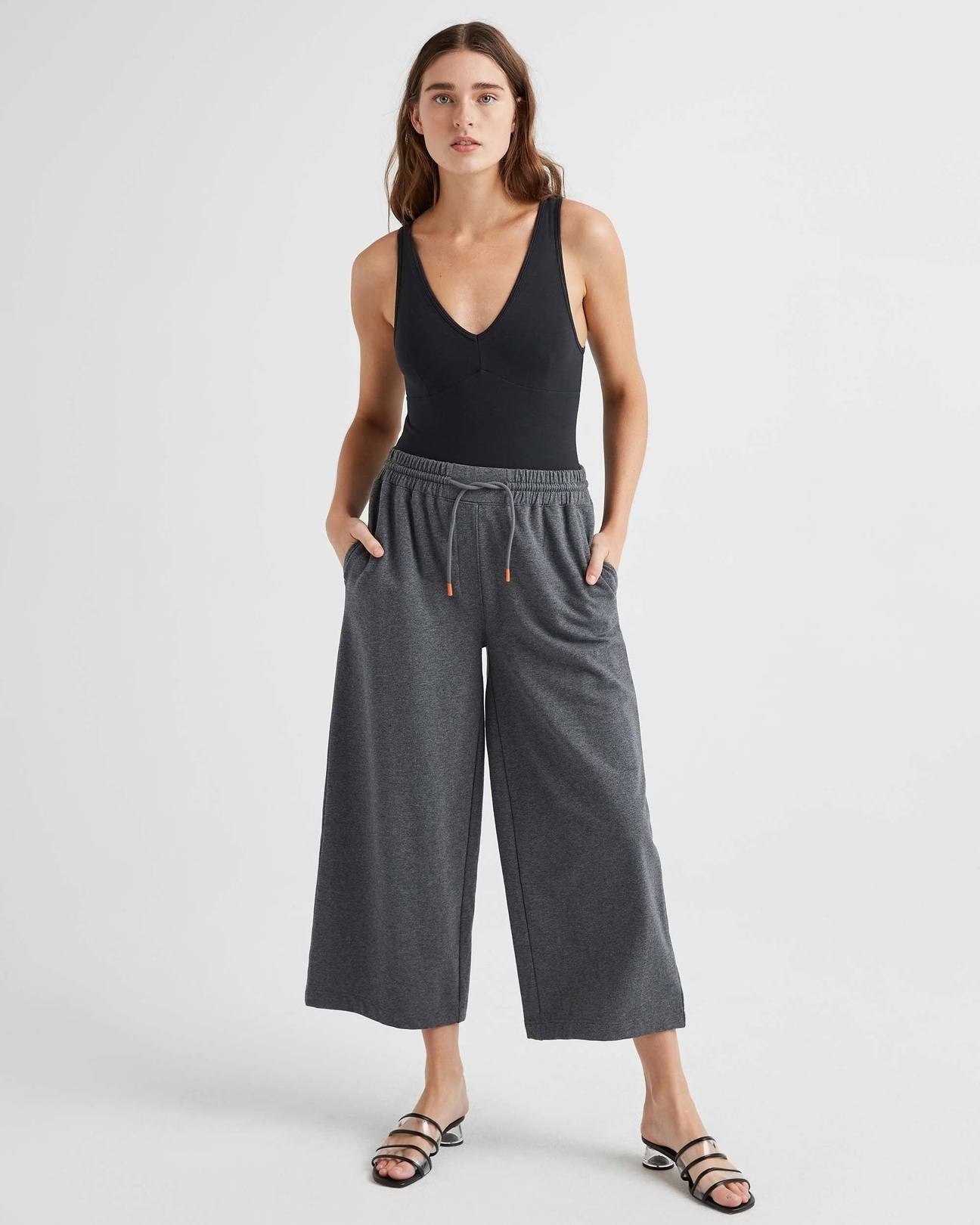 model wearing the pants in grey