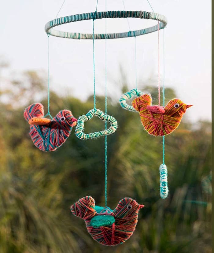 A DIY hanging decor made with yarn birds.