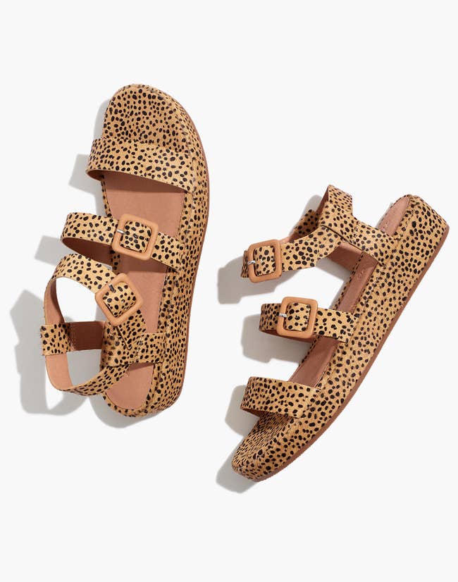 platform sandals with buckles and horizontal straps and a spotted calf hair design