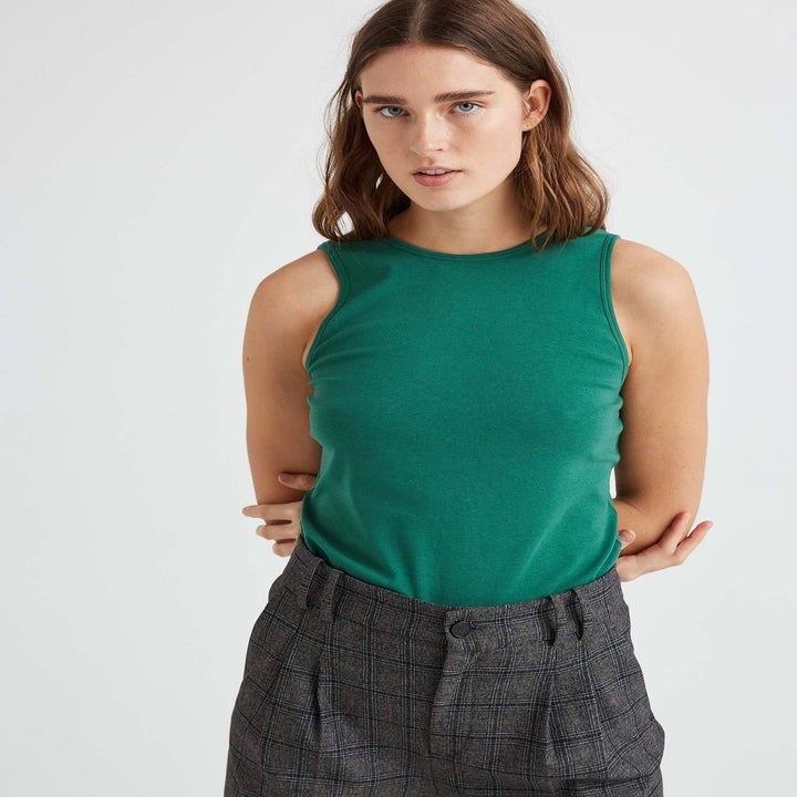model wearing the tank in emerald green