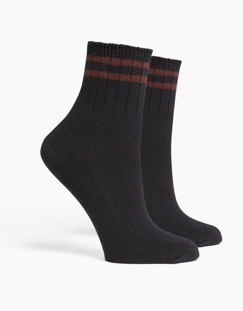 the black socks with red lines at the top