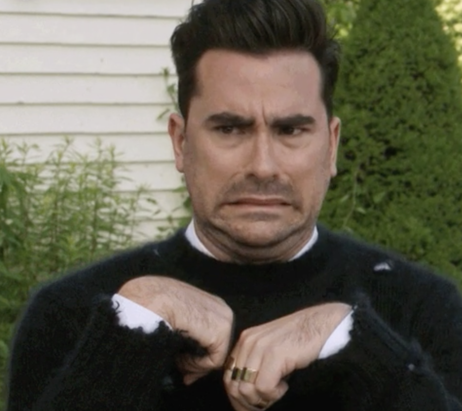 Annoyed and grossed out Dan Levy as David Rose