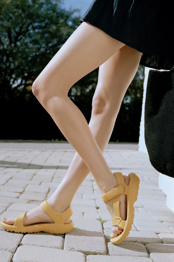 a model in the yellow sandals