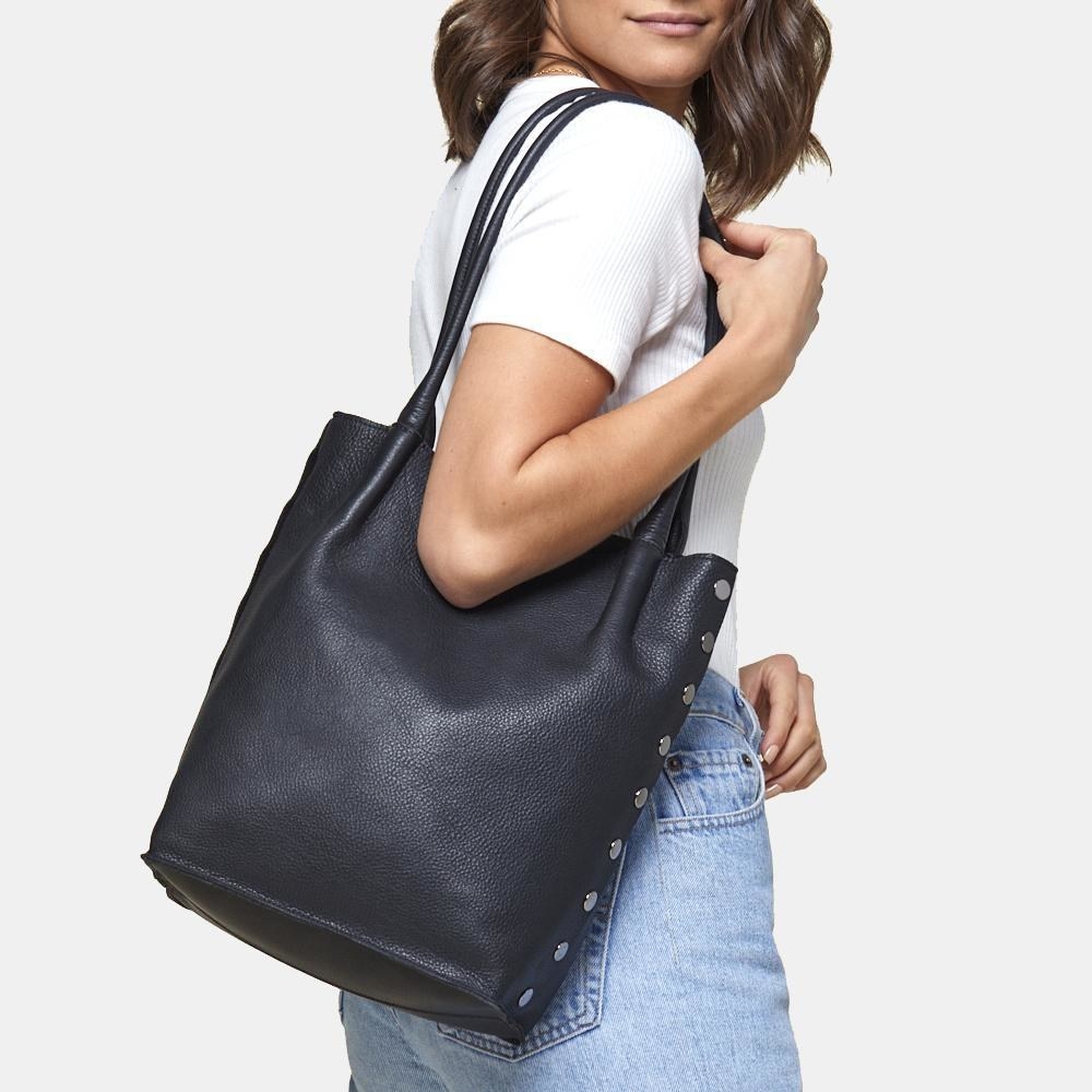 model wearing the black purse