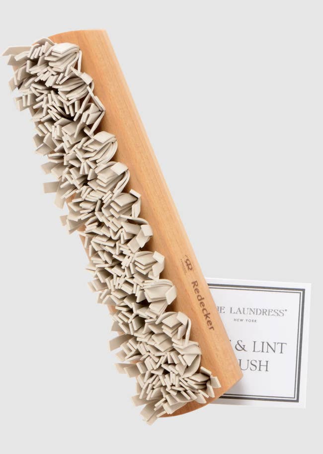 redecker pet hair and lint brush with a wooden handle
