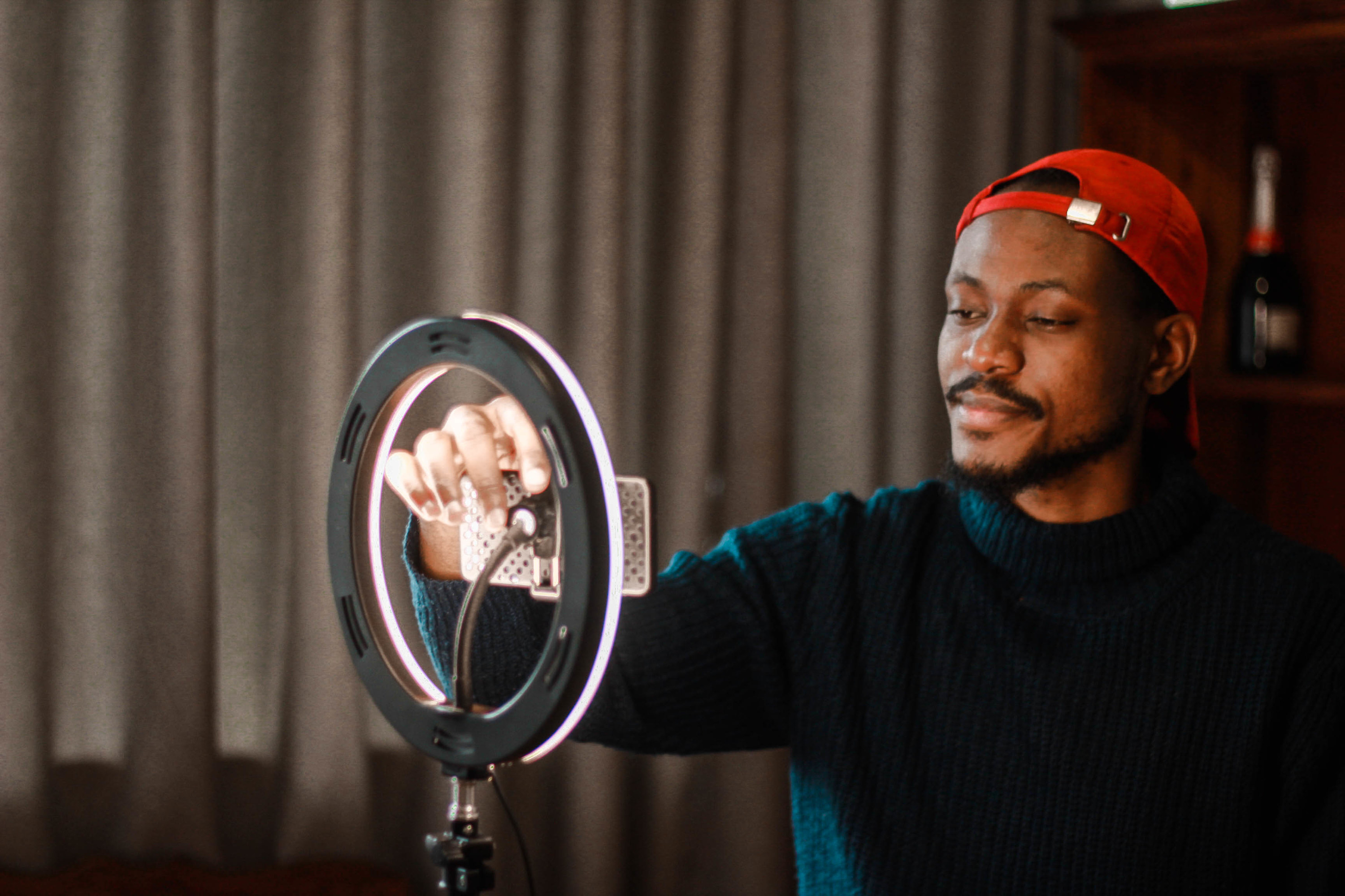 YouTuber setting up his camera inside his ring light.