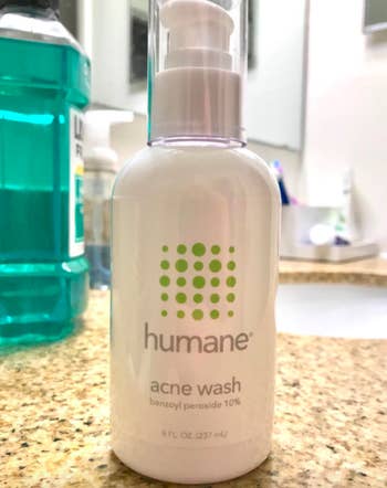 A customer review photo of the bottle of Humane Acne Body & Face Wash