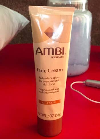 A customer review photo of the bottle of the Ambi Skincare Fade Cream.
