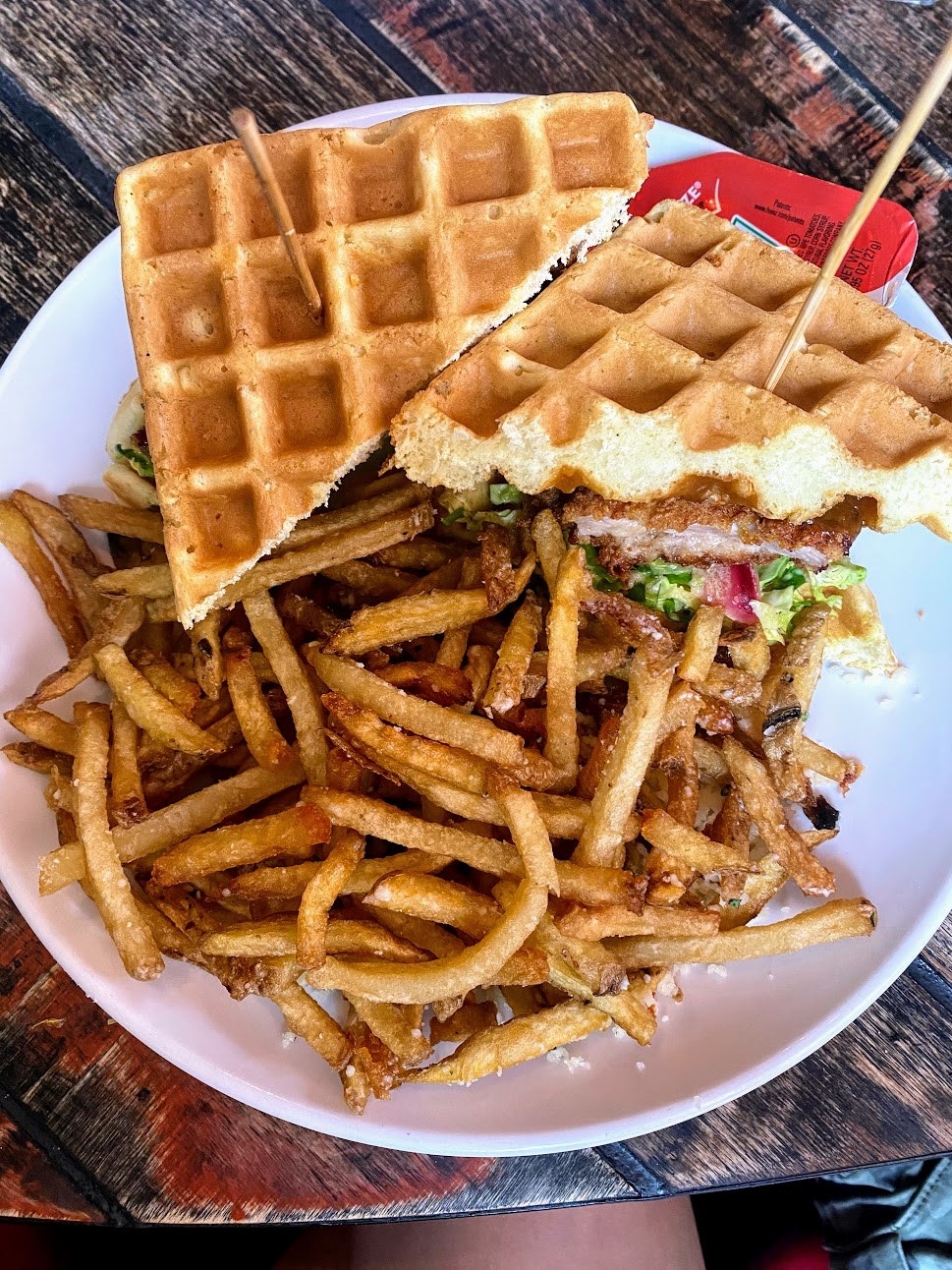 a waffle sandwich with fries