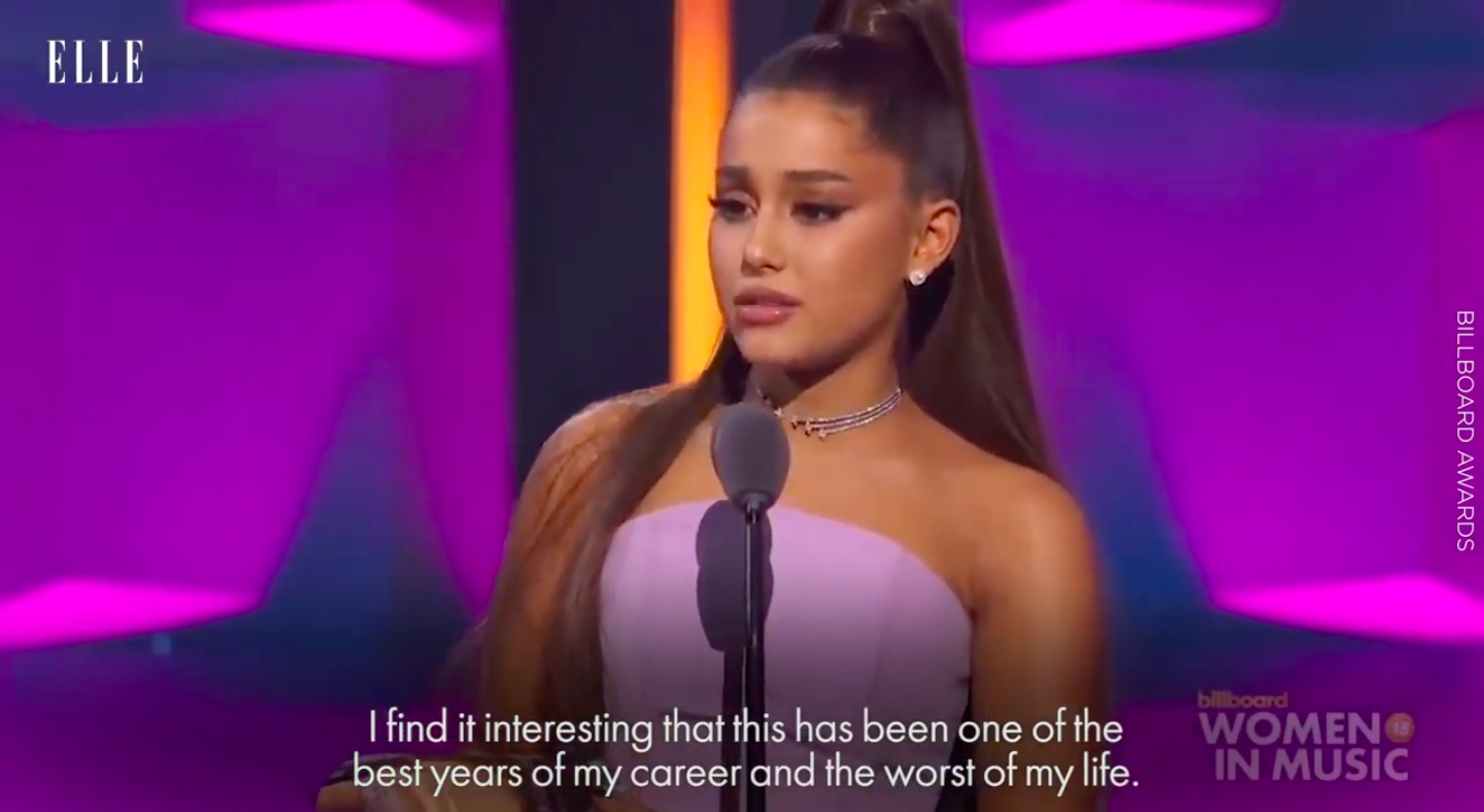 Ariana on-stage saying, &quot;I find it interesting that this has been one of the best years of my career and the worst of my life&quot;