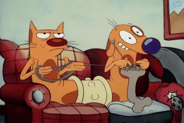 Gif of the characters Cat and Dog from &quot;CatDog&quot; knitting on a couch