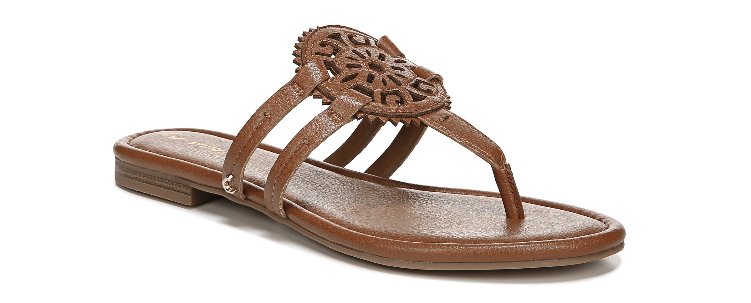The brown sandals have a medallion pendant and two straps