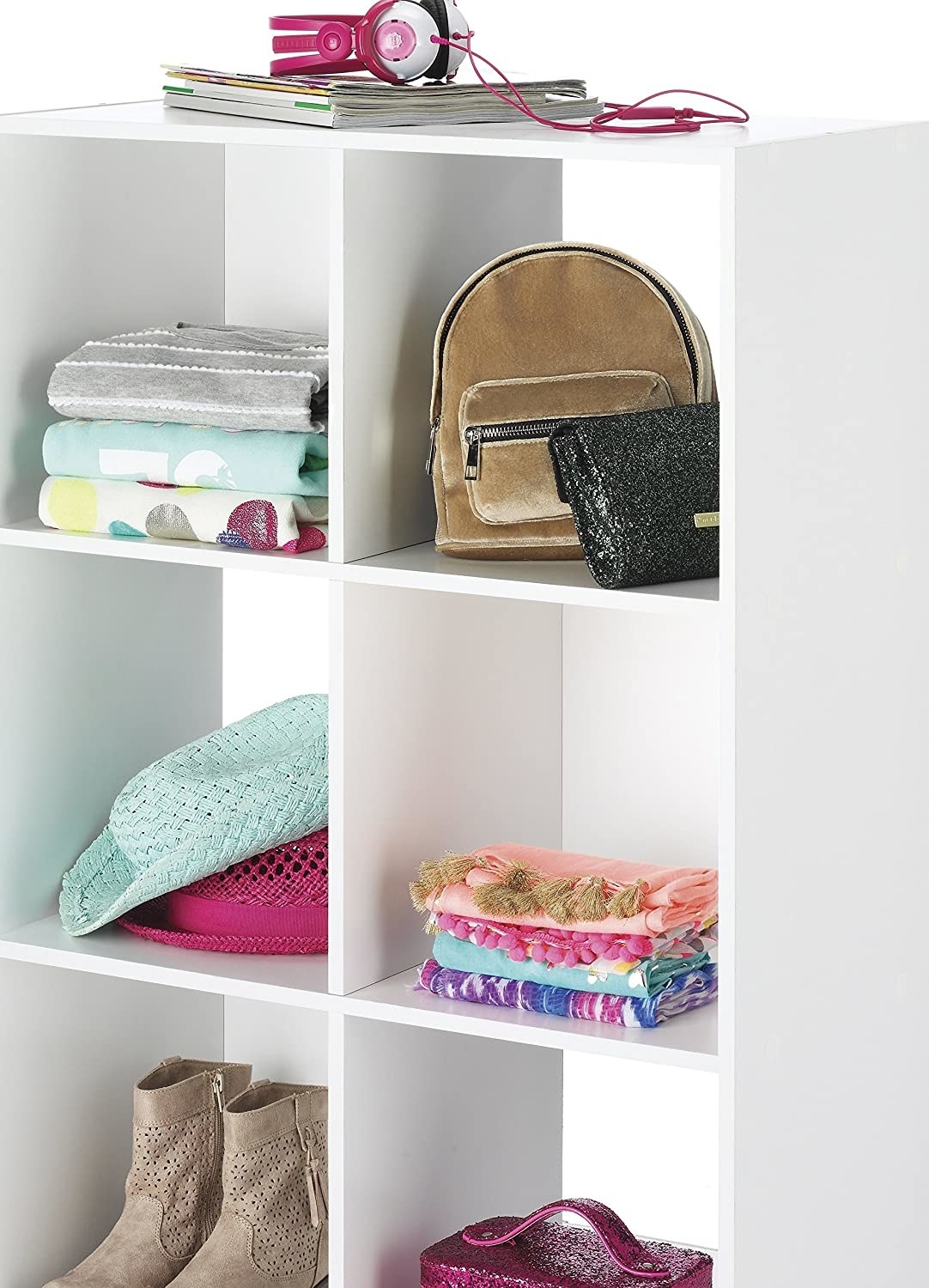 Large white cube grid storage shelf system holding items