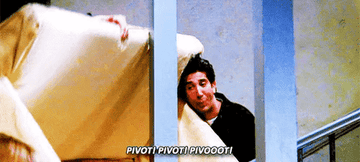 Ross yelling pivot while he holds a couch up the stairs
