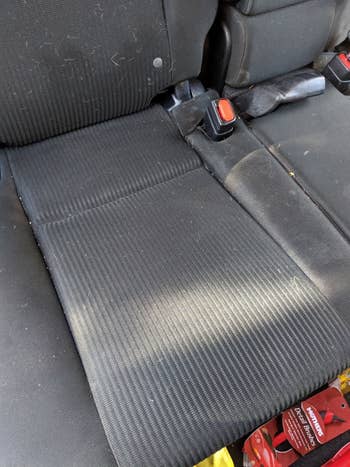 Reviewer's after photo showing a spotless car seat that was cleaned