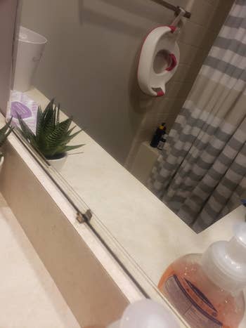 A spotless bathroom mirror after it was cleaned