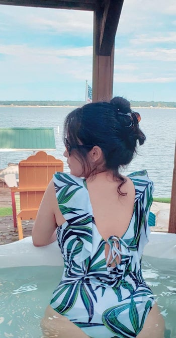 back view of a reviewer wearing the same suit