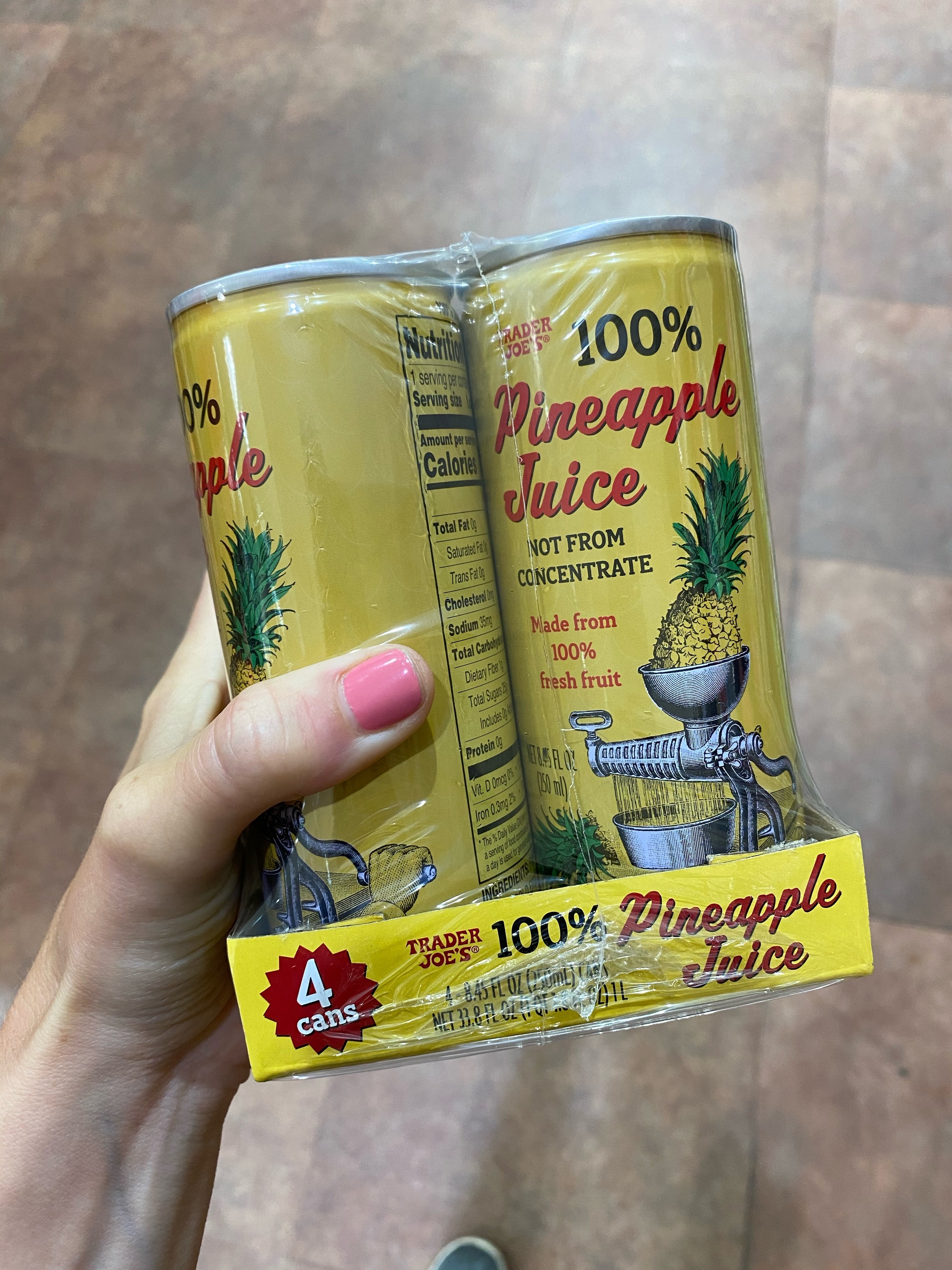 Cans of Trader Joe&#x27;s 100% pineapple juice.