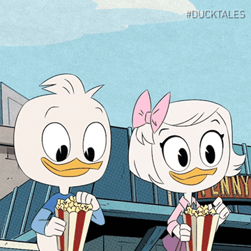 Dewey and Wendy snacking on popcorn and smiling