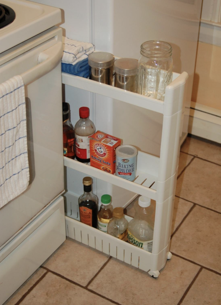 Reviewer&#x27;s photo of the slide-out storage tower filled with kitchen items