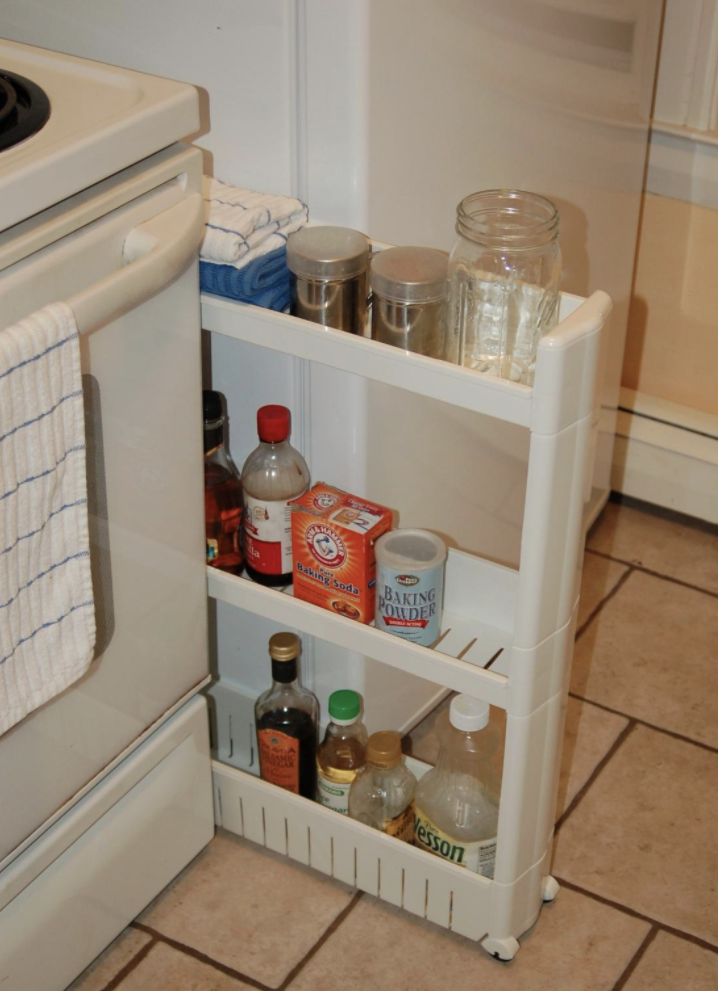 Reviewer&#x27;s photo of the slide-out storage tower filled with kitchen items