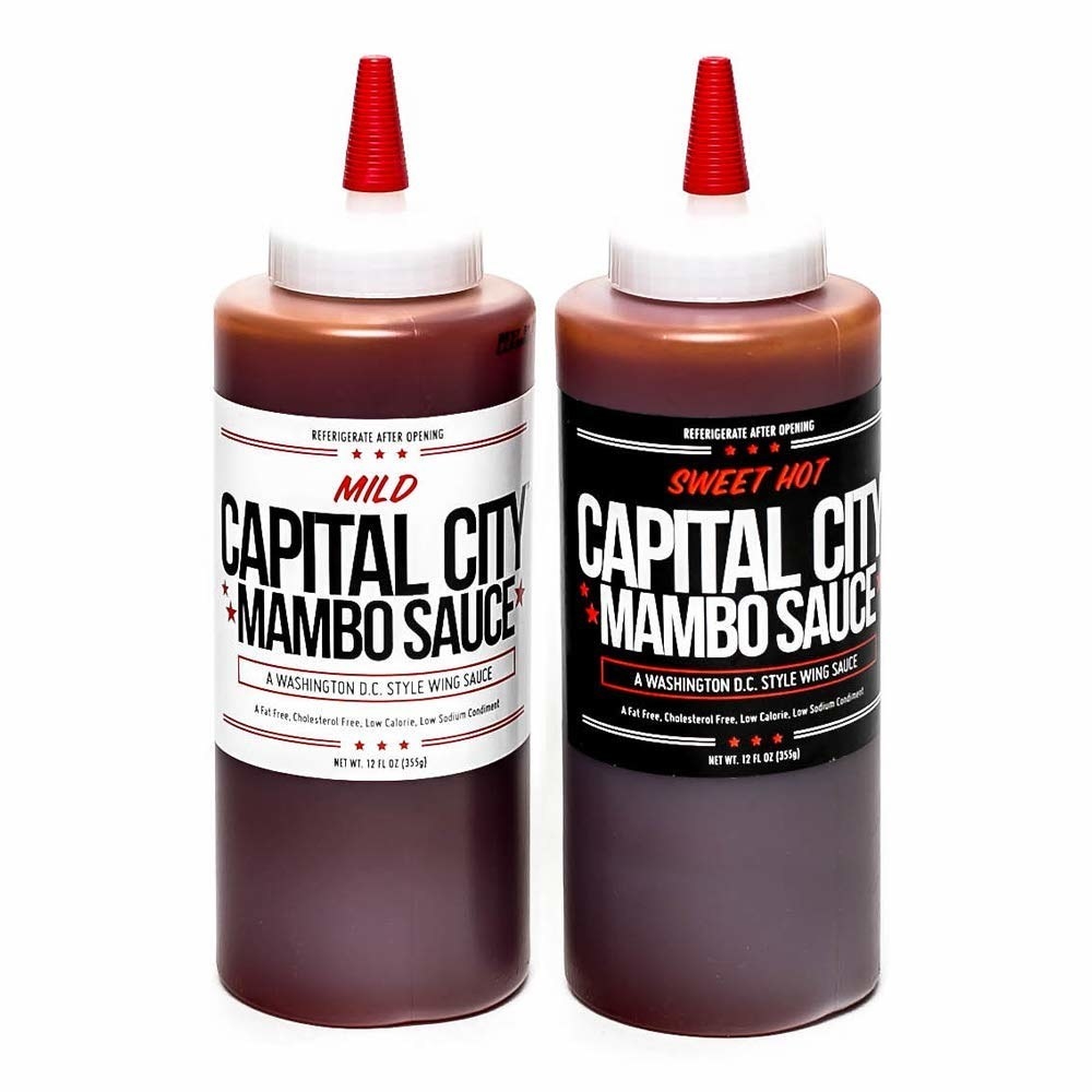 Two bottles of the Capital City Mambo Sauce in Mild and Sweet Hot