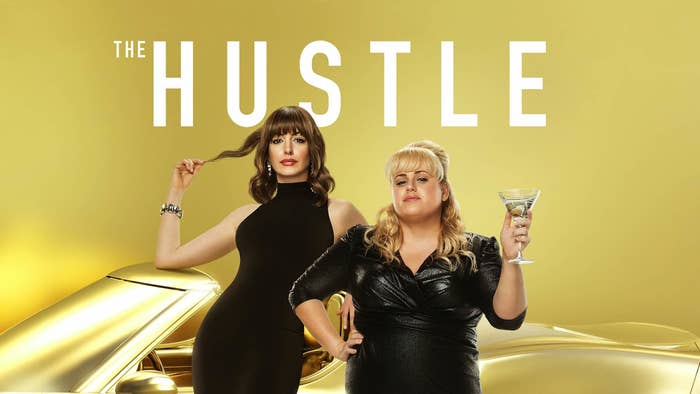 Movie poster for &quot;The Hustle&quot; featuring Anne Hathaway and Rebel Wilson posing in front of a gold sports car