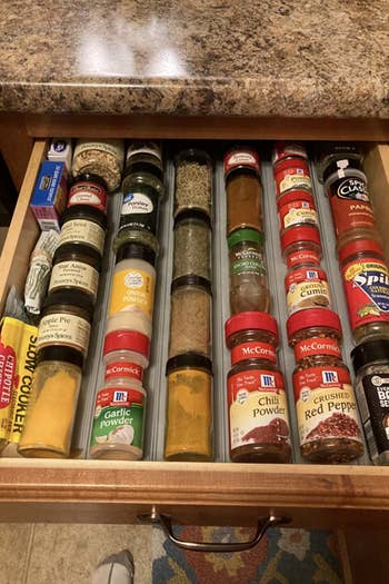 Reviewer's after photo shows the same drawer but with the spice rack drawer organizer in use