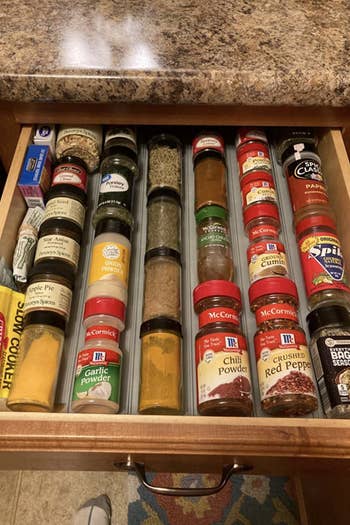 Reviewer's after photo shows the same drawer but with the spice rack drawer organizer in use