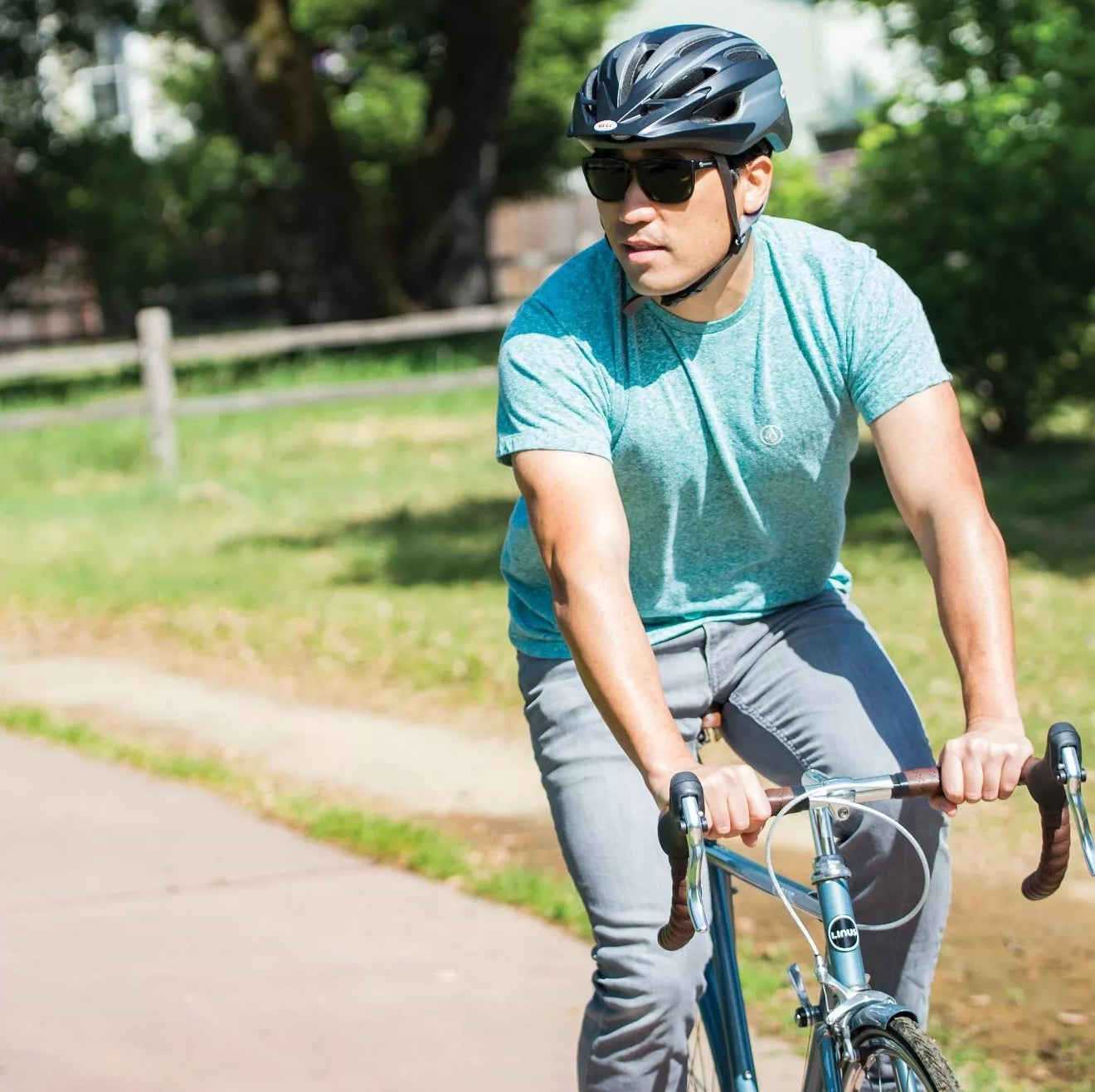 A model riding on a bike with the adjustable helmet