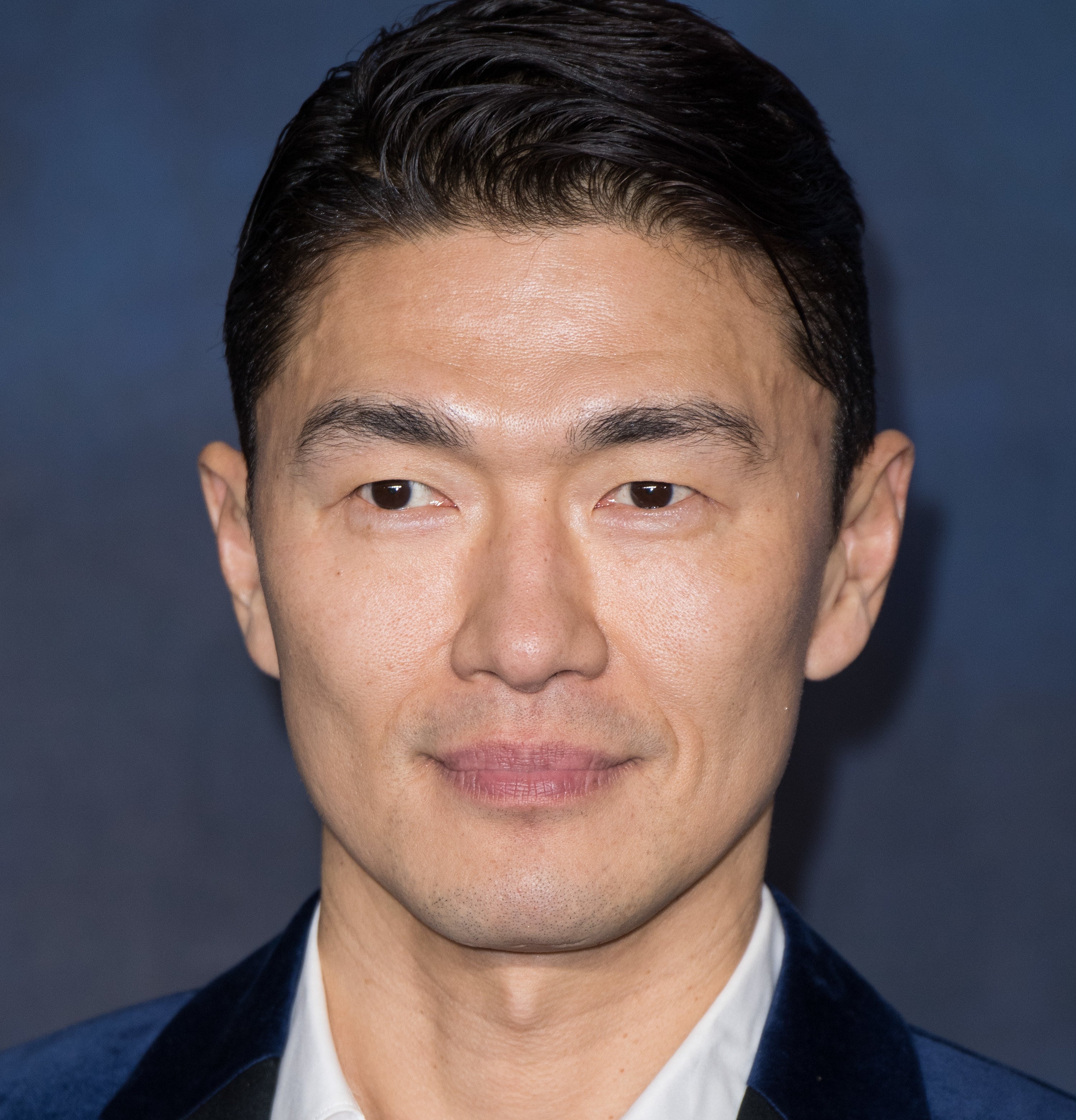 Close-up of Rick Yune smiling slightly