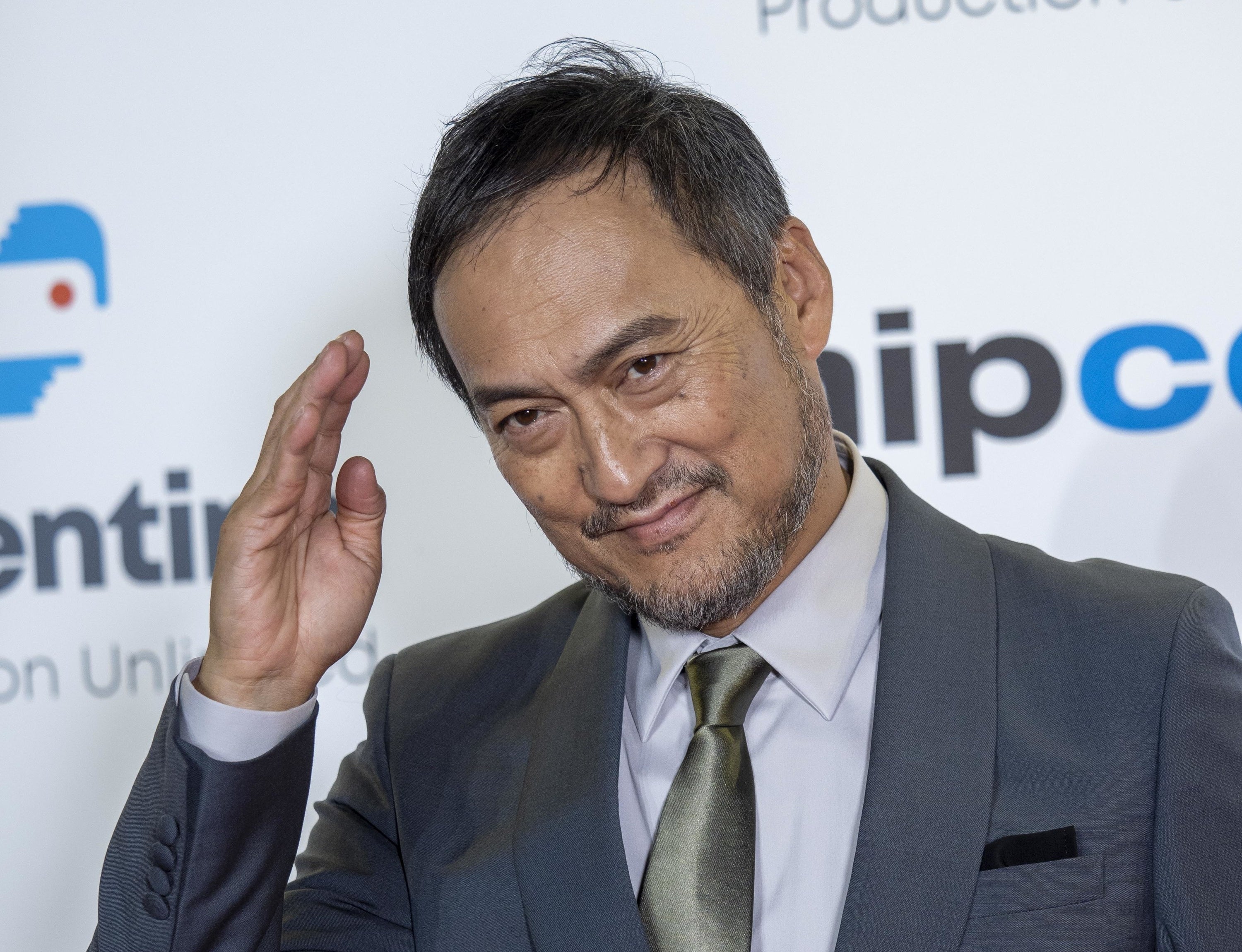 Ken Watanabe giving a salute on the red carpet